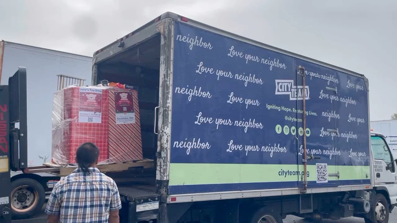 A pallet of Joey's Toy Drive collection boxes loaded onto a CityTeam box truck