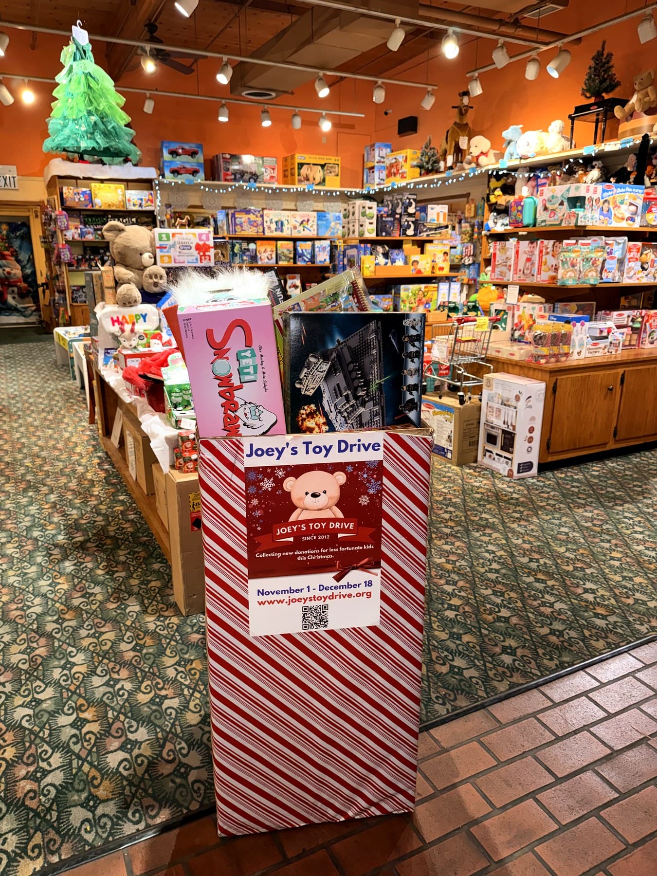 A display of new, unwrapped toys collected for Joey's Toy Drive, ready to be sorted at the San Jose warehouse