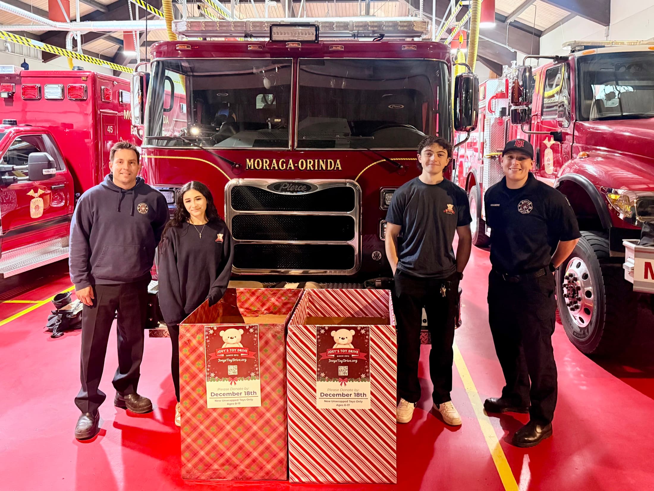 Joey's Toy Drive collection boxes filled with donated toys at a Bay Area fire station