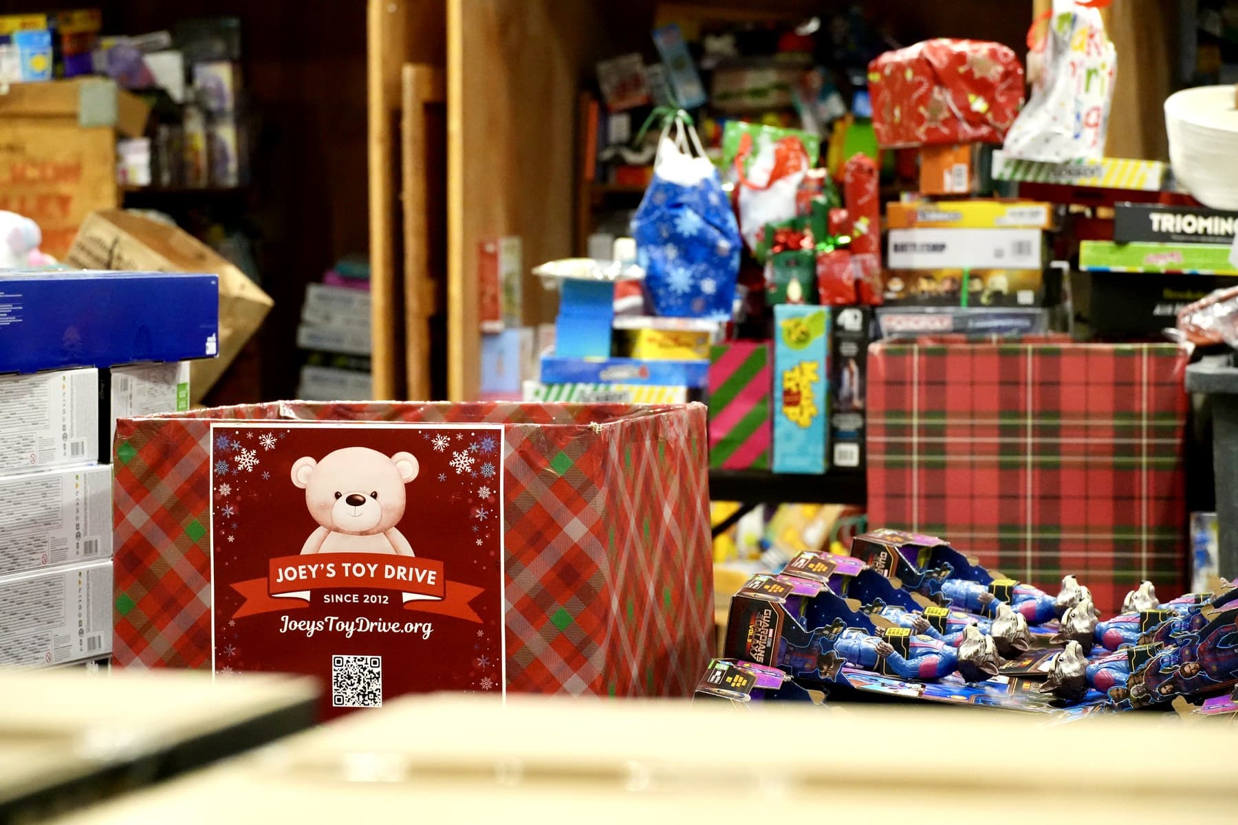 The San Jose warehouse mid-season, stacked with sorted toys ready for delivery across the Bay Area